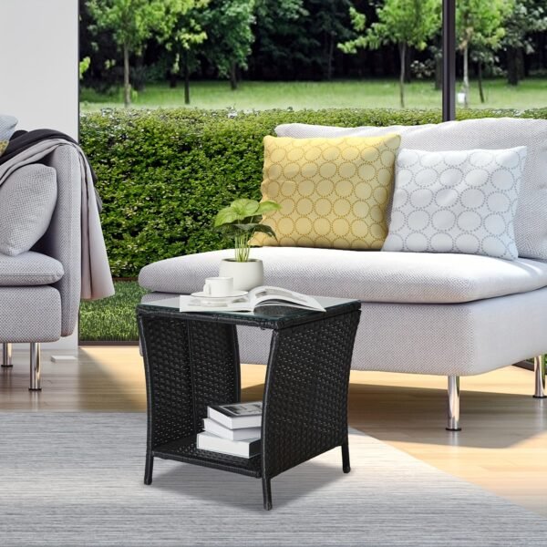 "A black four-line rattan double-layered side table with glass top, suitable for small living rooms in households