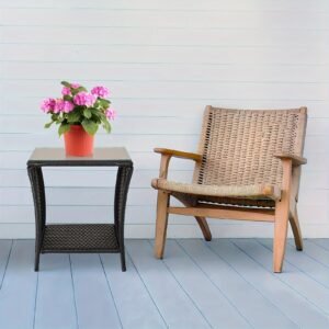 "A black four-line rattan double-layered side table with glass top, suitable for small living rooms in households